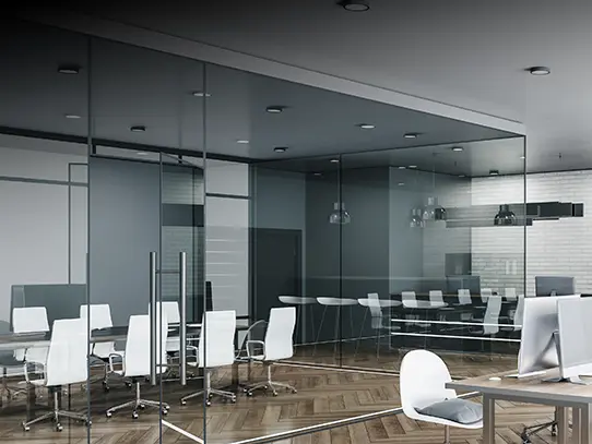 Modern office conference room with glass partitions and executive seating