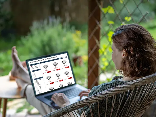 Customer comparing hot tub models online before making a purchase
