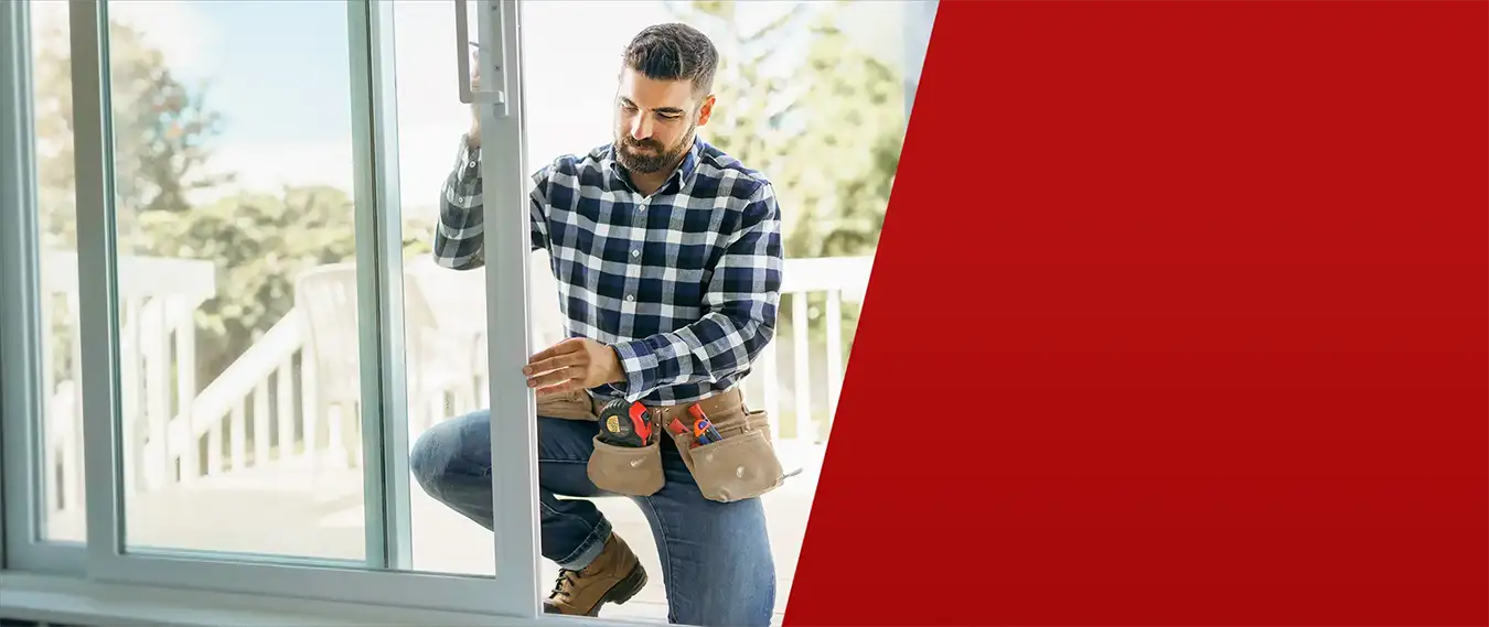 Professional pool contractor installing residential glass doors and windows