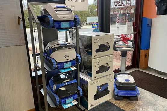 Robotic pool cleaners and supplies displayed at Fieldstone Glass Pool & Spas showroom
