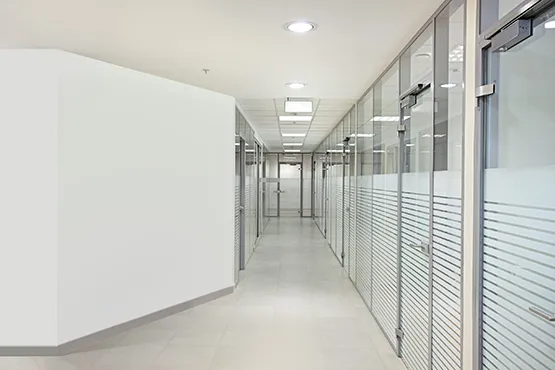 Modern commercial showroom with glass display partitions for pool and spa products