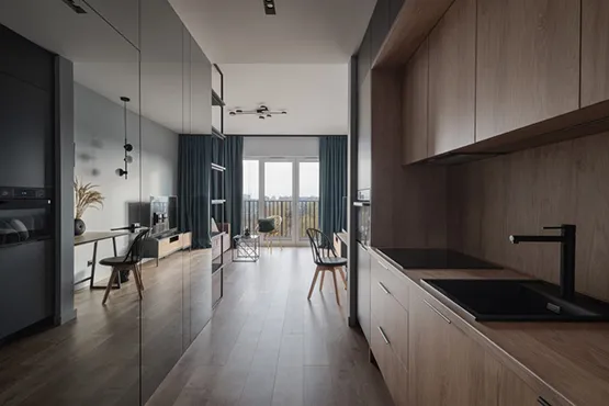 Modern kitchen with sleek cabinetry and glass partition design