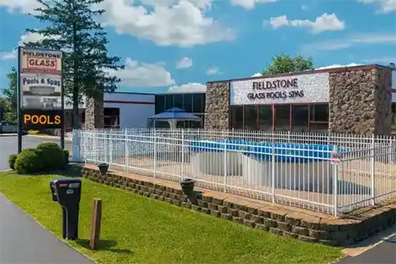 Fieldstone Glass Pool & Spas showroom featuring above ground pools and hot tubs for sale